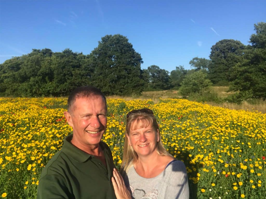 Andy and Anja among wildflowers at the Gift a Tree nature reserve