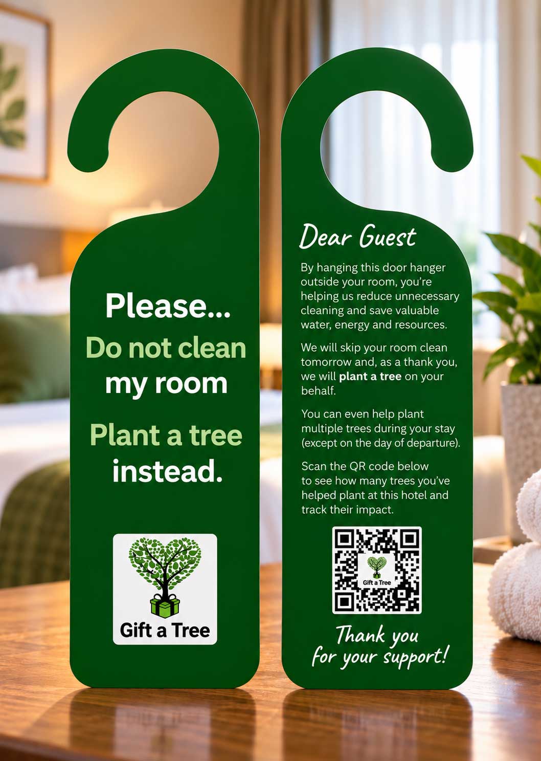 Front and back of the Gift a Tree hotel room door hanger