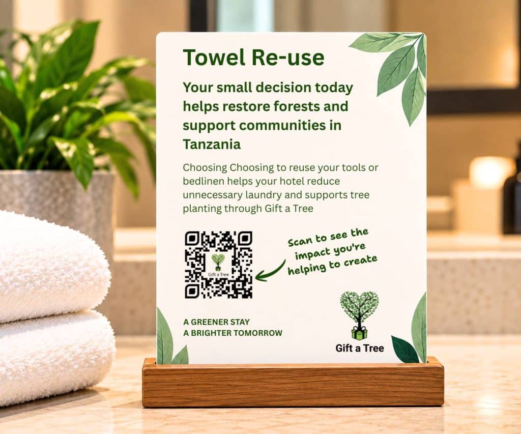 Hotel towel re-use card explaining how guests can support tree planting